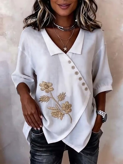 Valeria - Blusa asimétrica con bordado floral