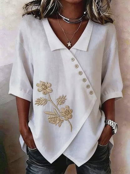 Valeria - Blusa asimétrica con bordado floral